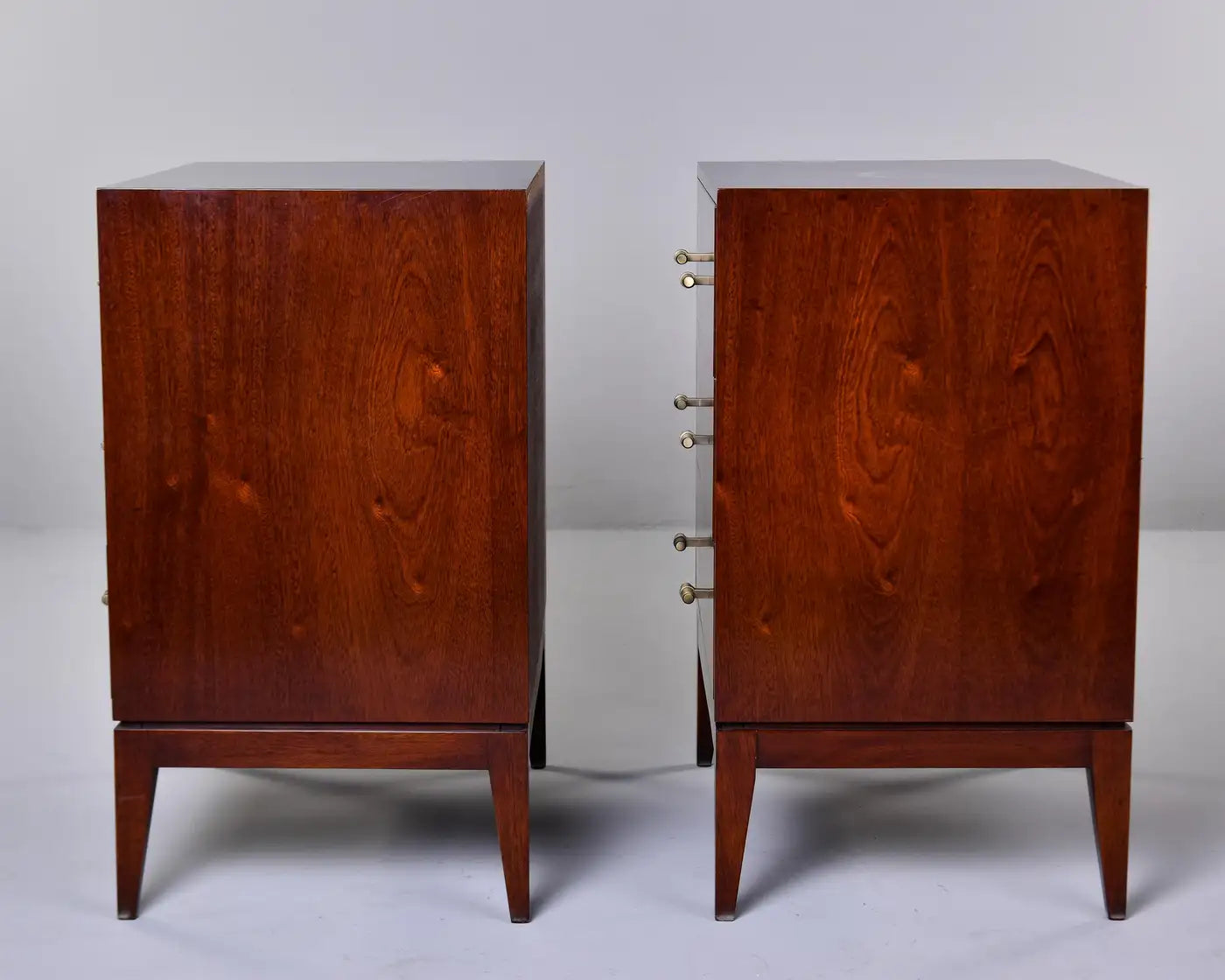 Pair of wooden speakers on a gray background