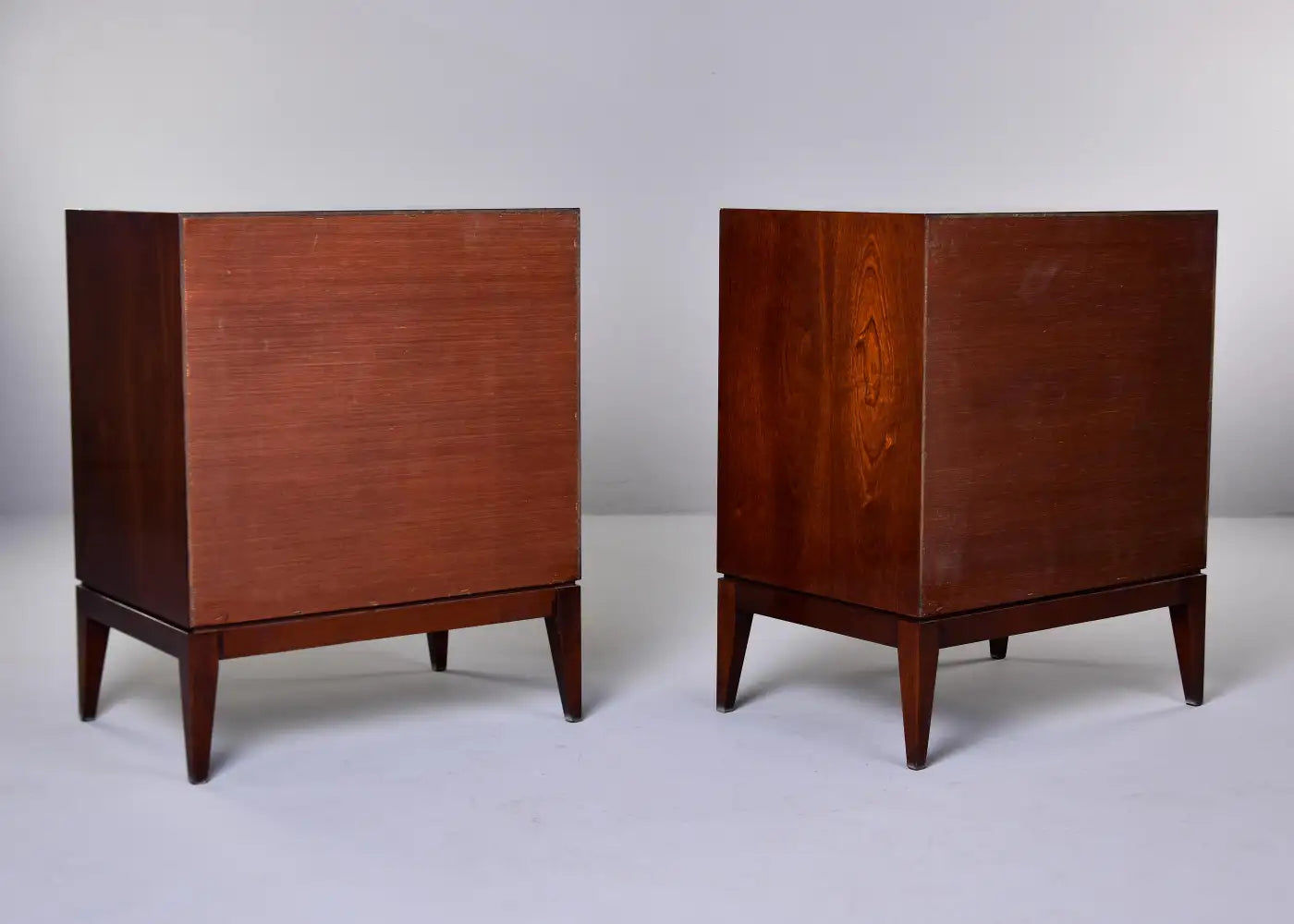 Two wooden cabinets on a white background