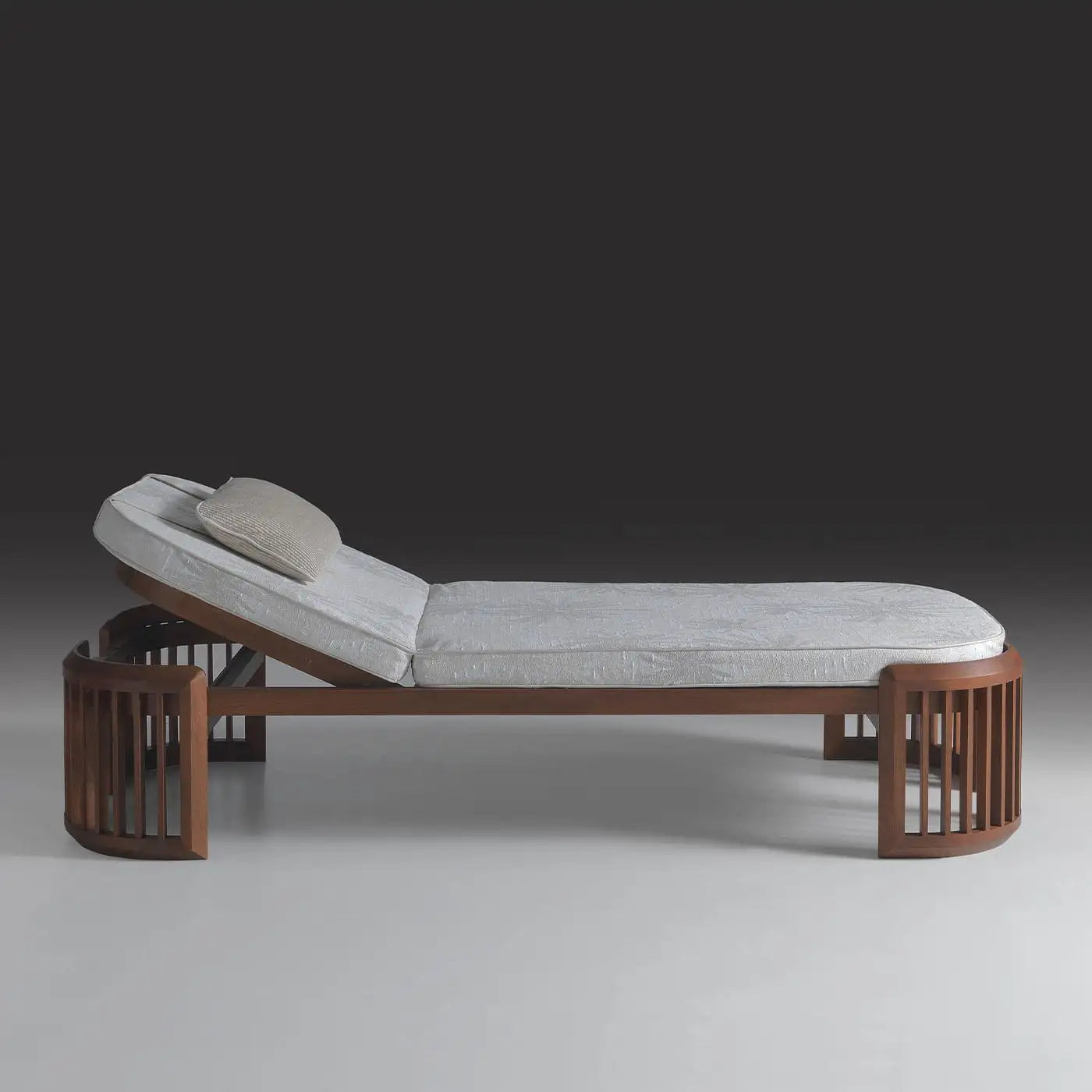 Modern lounge chair with wooden frame and gray cushion on a gradient background