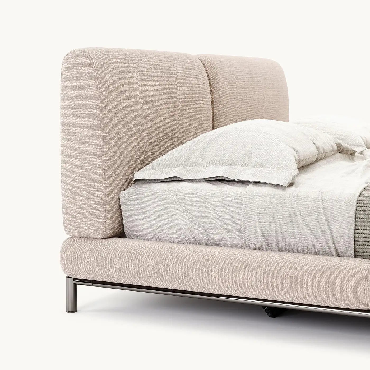 Beige upholstered bed with white bedding on a white background