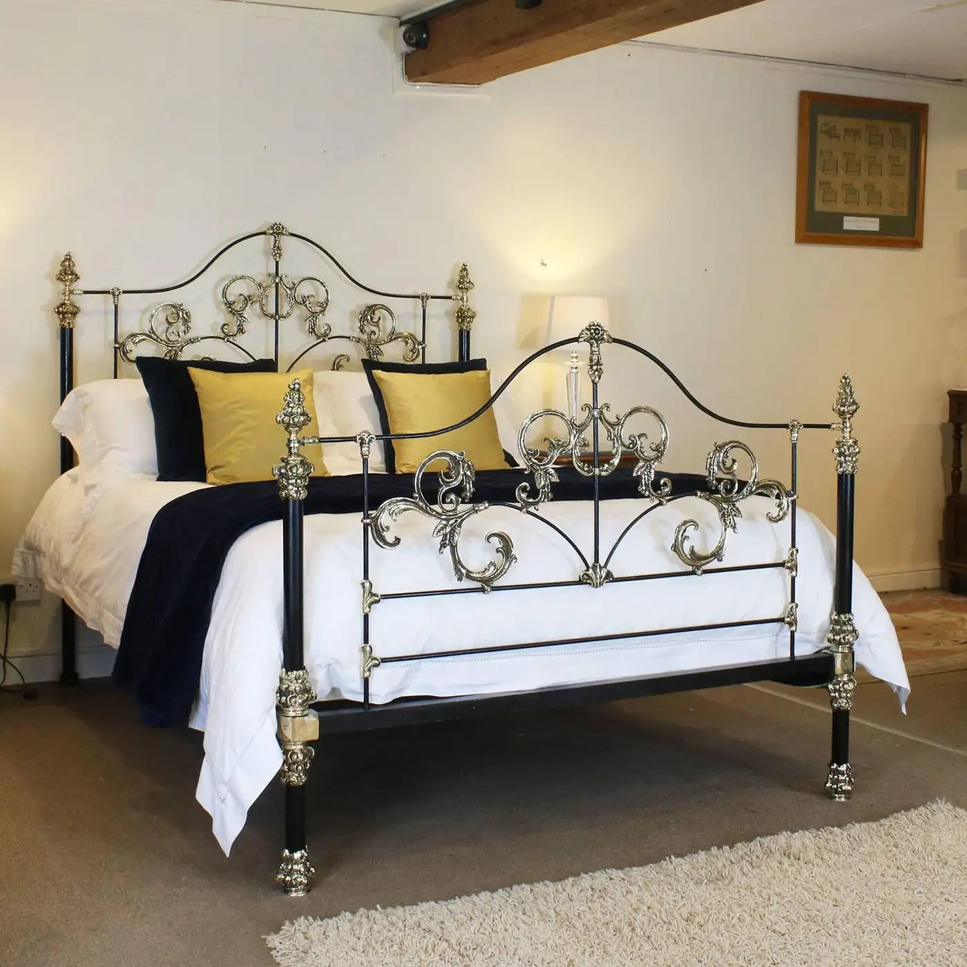 Decorative metal bed with ornate design in a bedroom setting.