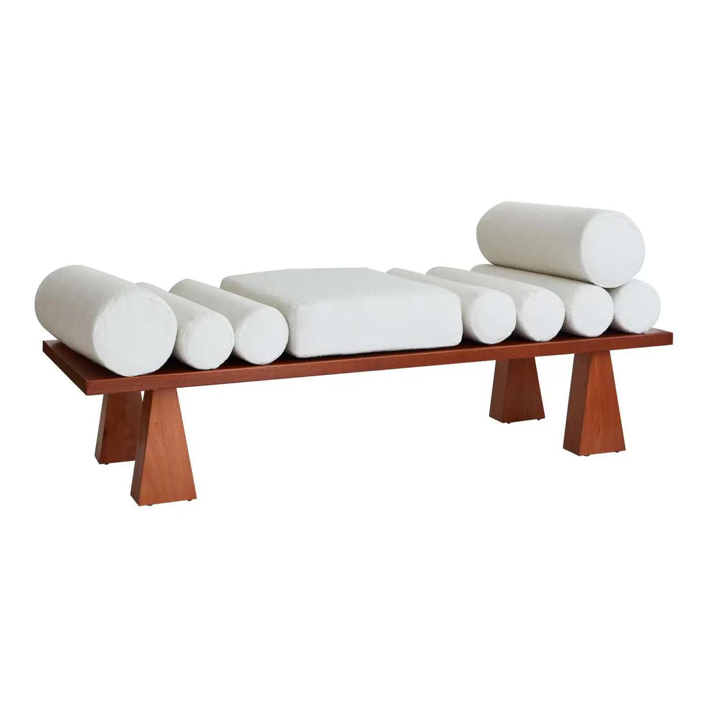 Wooden bench with cylindrical white cushions on a white background