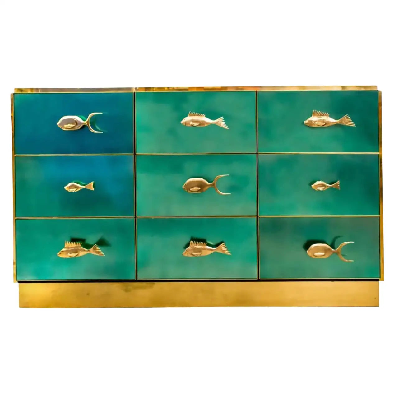 Teal dresser with gold fish-shaped handles on a white background