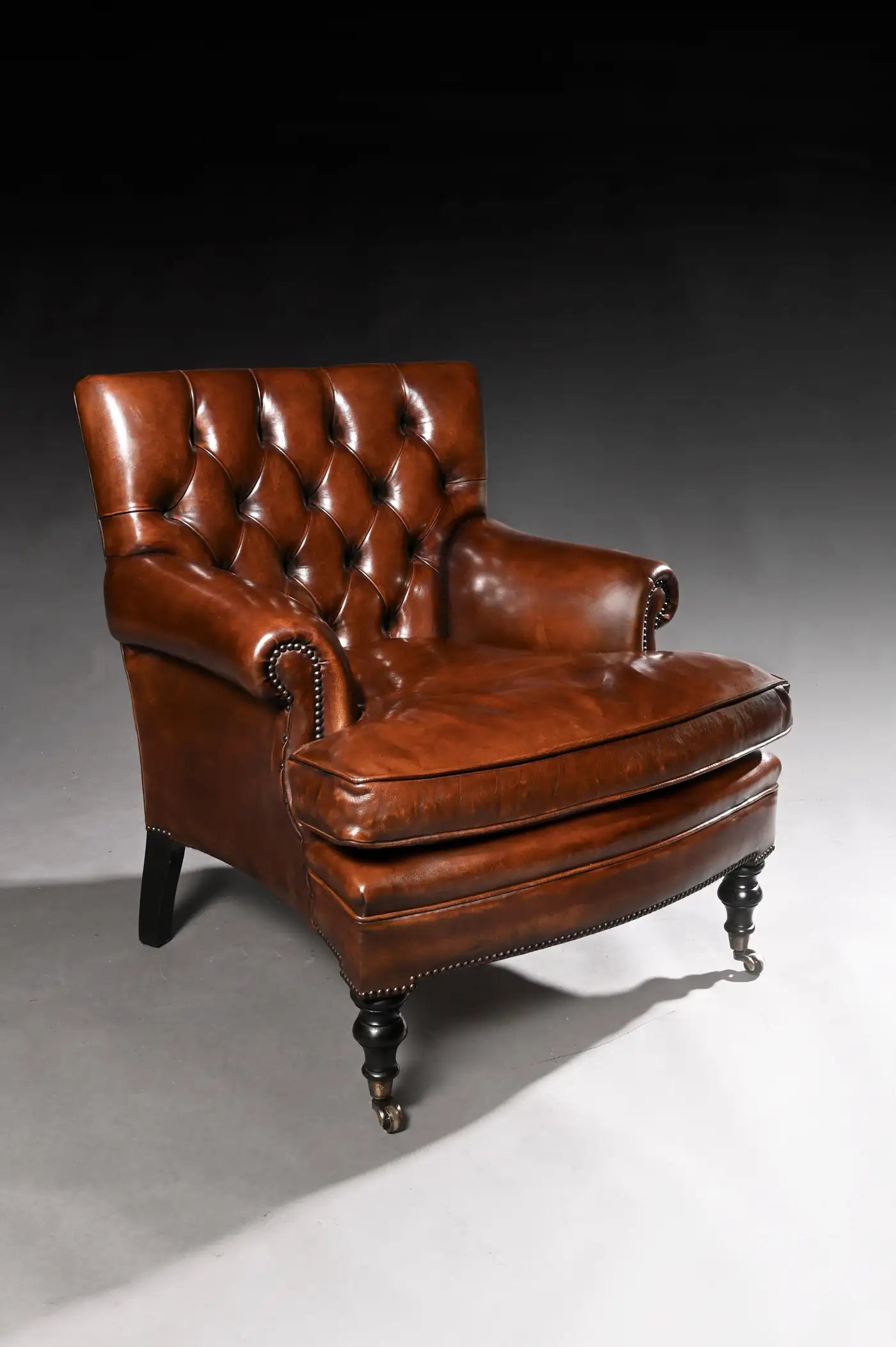 Brown leather armchair on a gray background