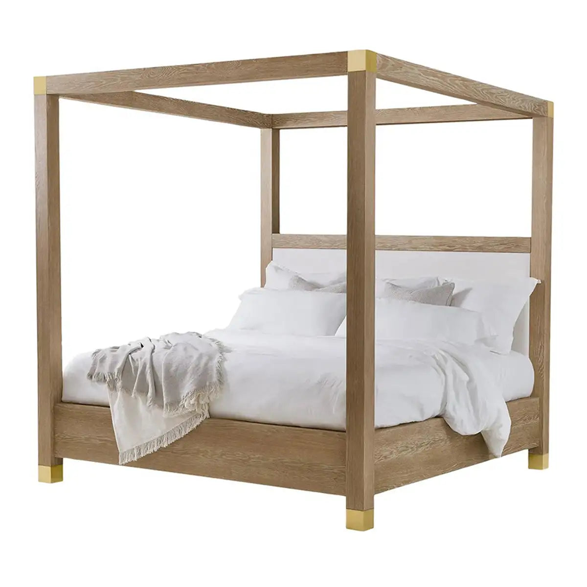 Wooden canopy bed with white bedding on a white background