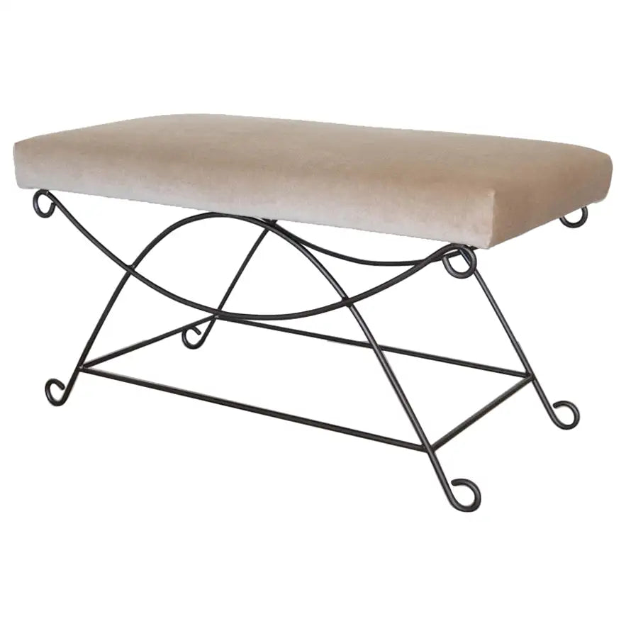 Beige cushioned bench with a black metal frame on a white background