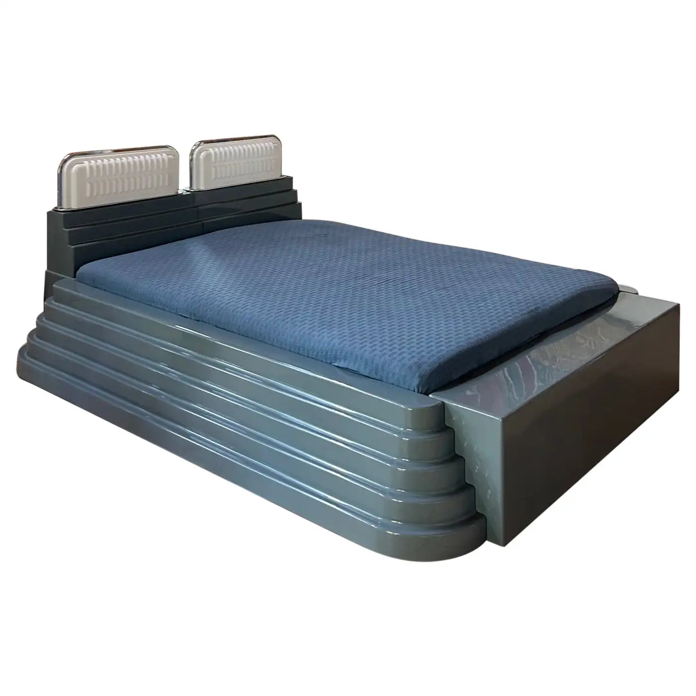 Blue mattress on a metal frame with a white background