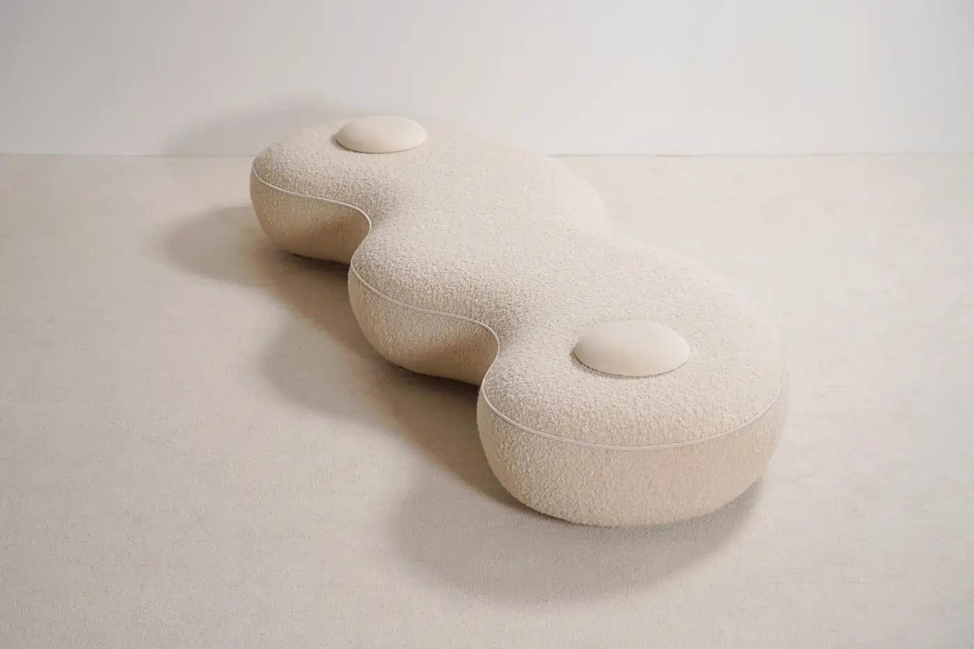 White textured cushion on a light gray background
