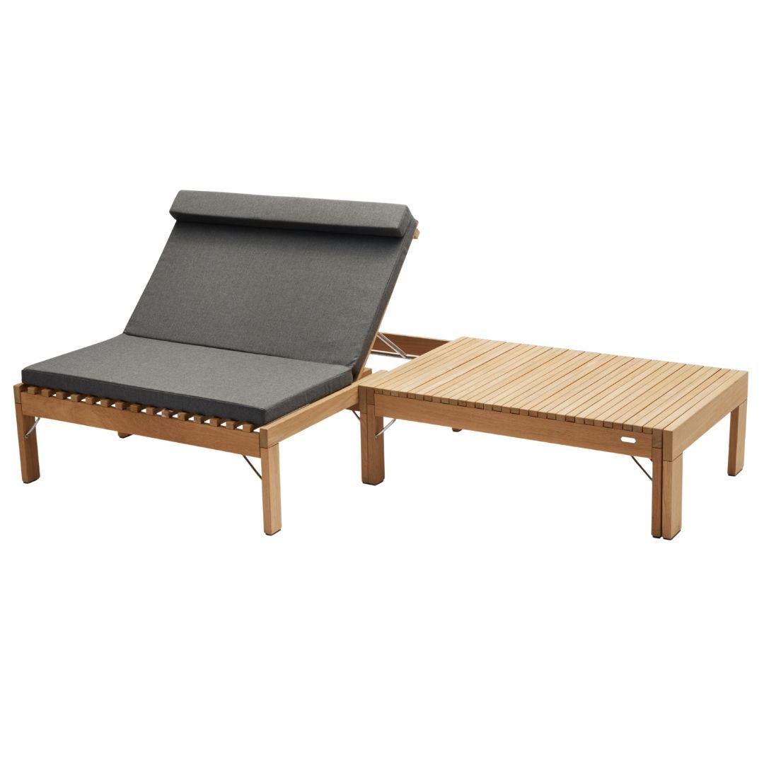 Wooden sun lounger with gray cushion on a white background