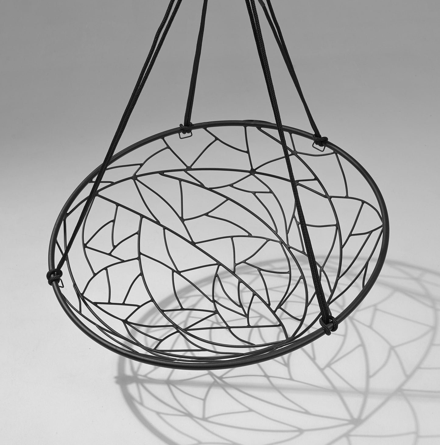 Decorative hanging chair with stained glass design on a gray background
