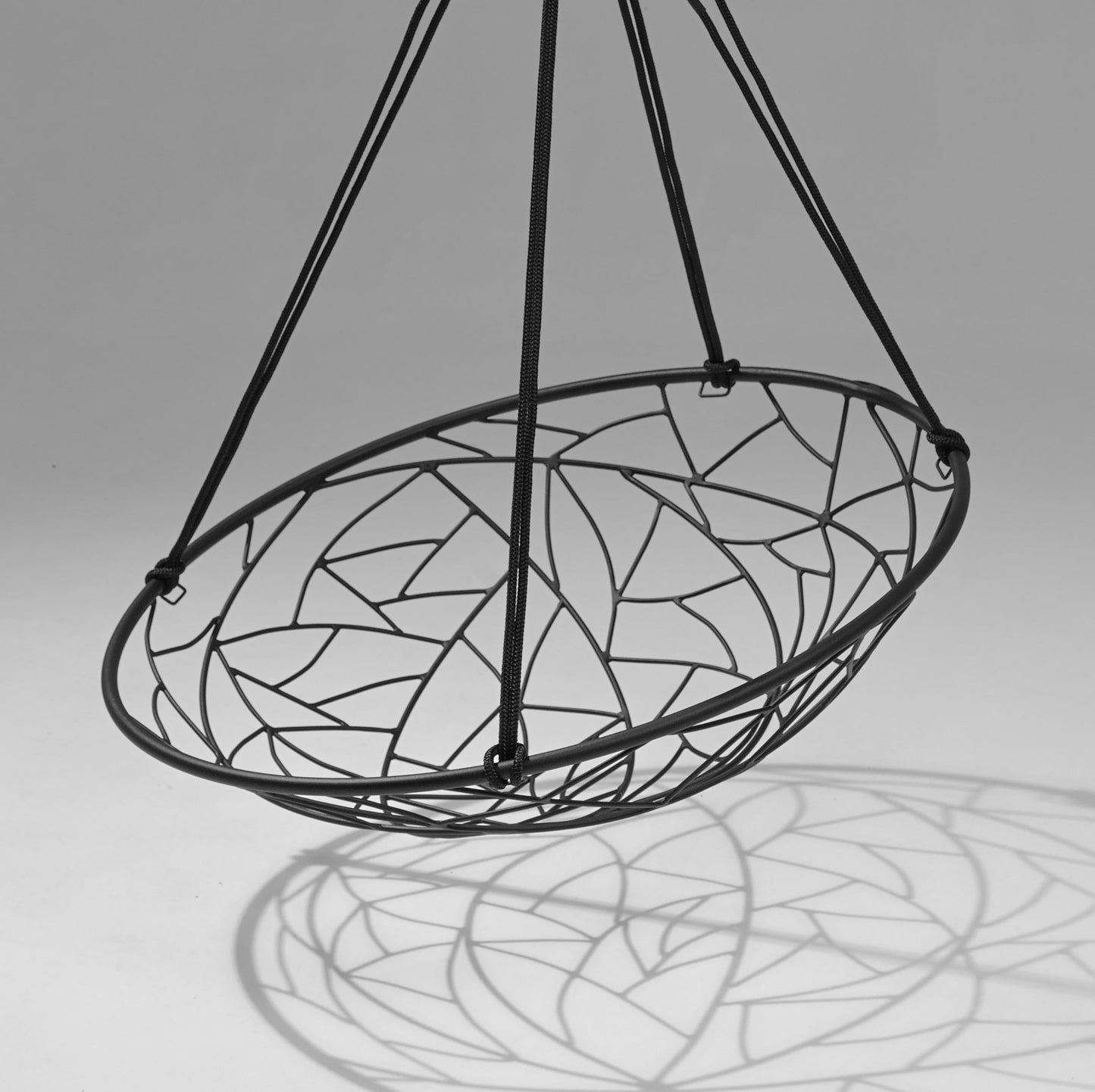Decorative hanging basket with stained glass design on a gray background