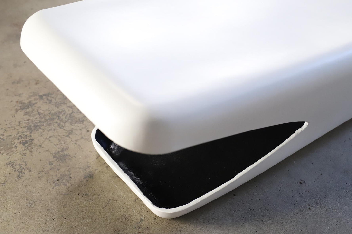White and black object on a concrete surface