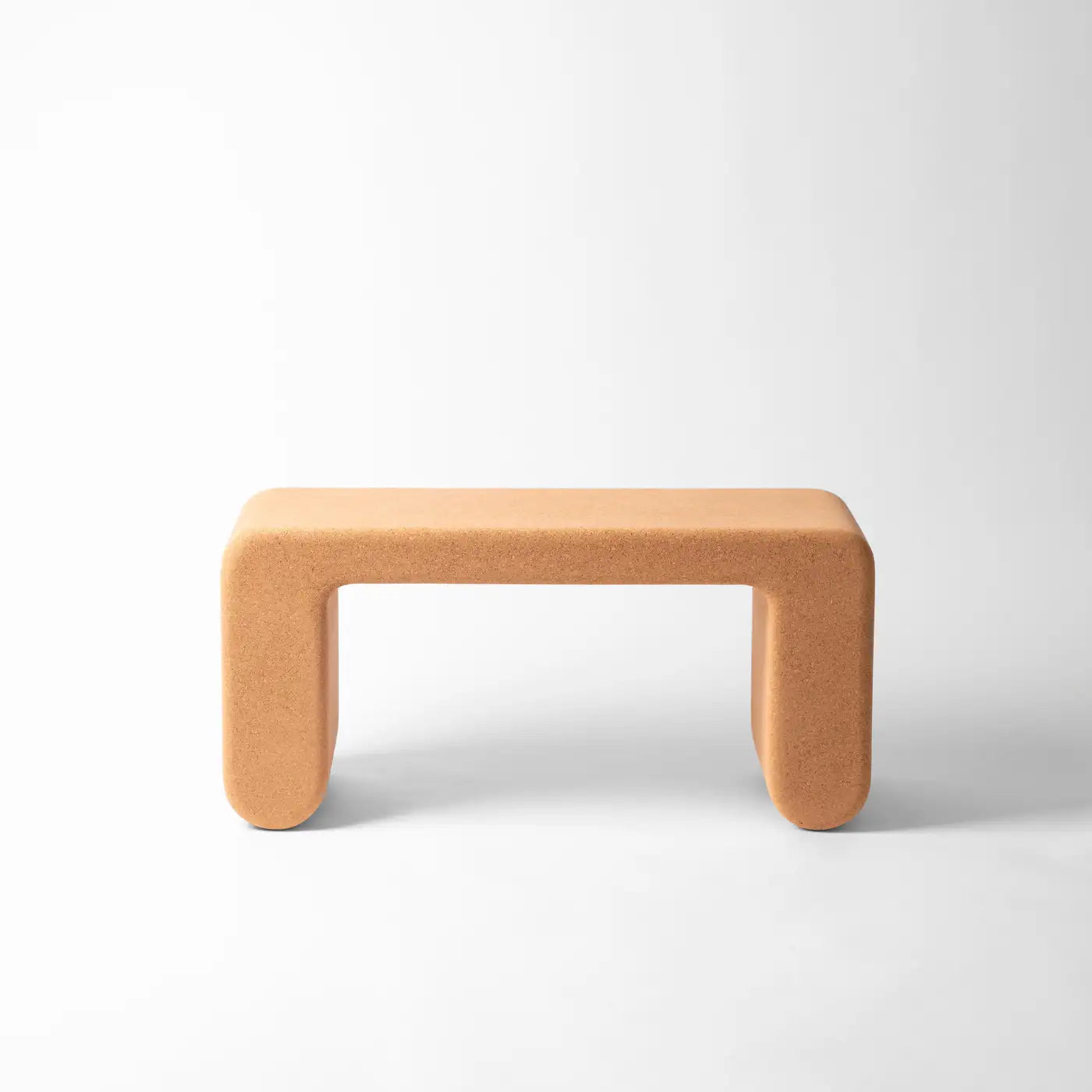 Coral-colored stool on a white background