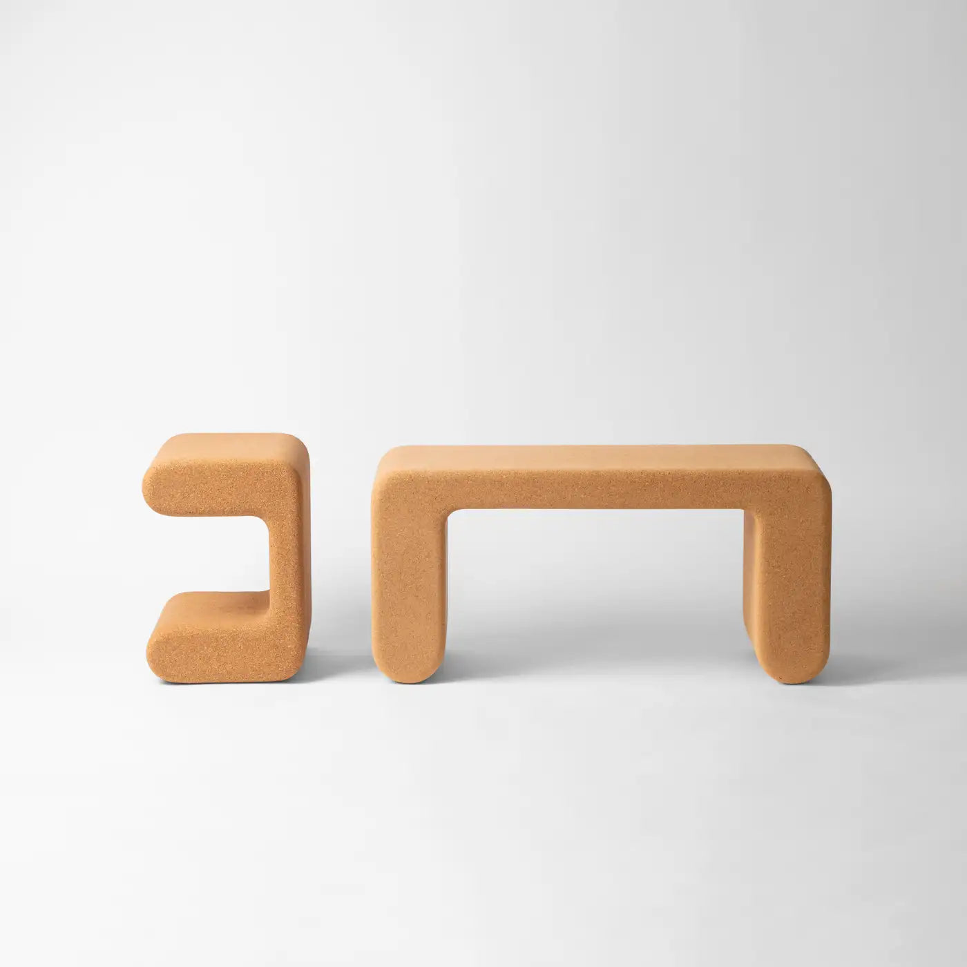 Two orange benches on a white background