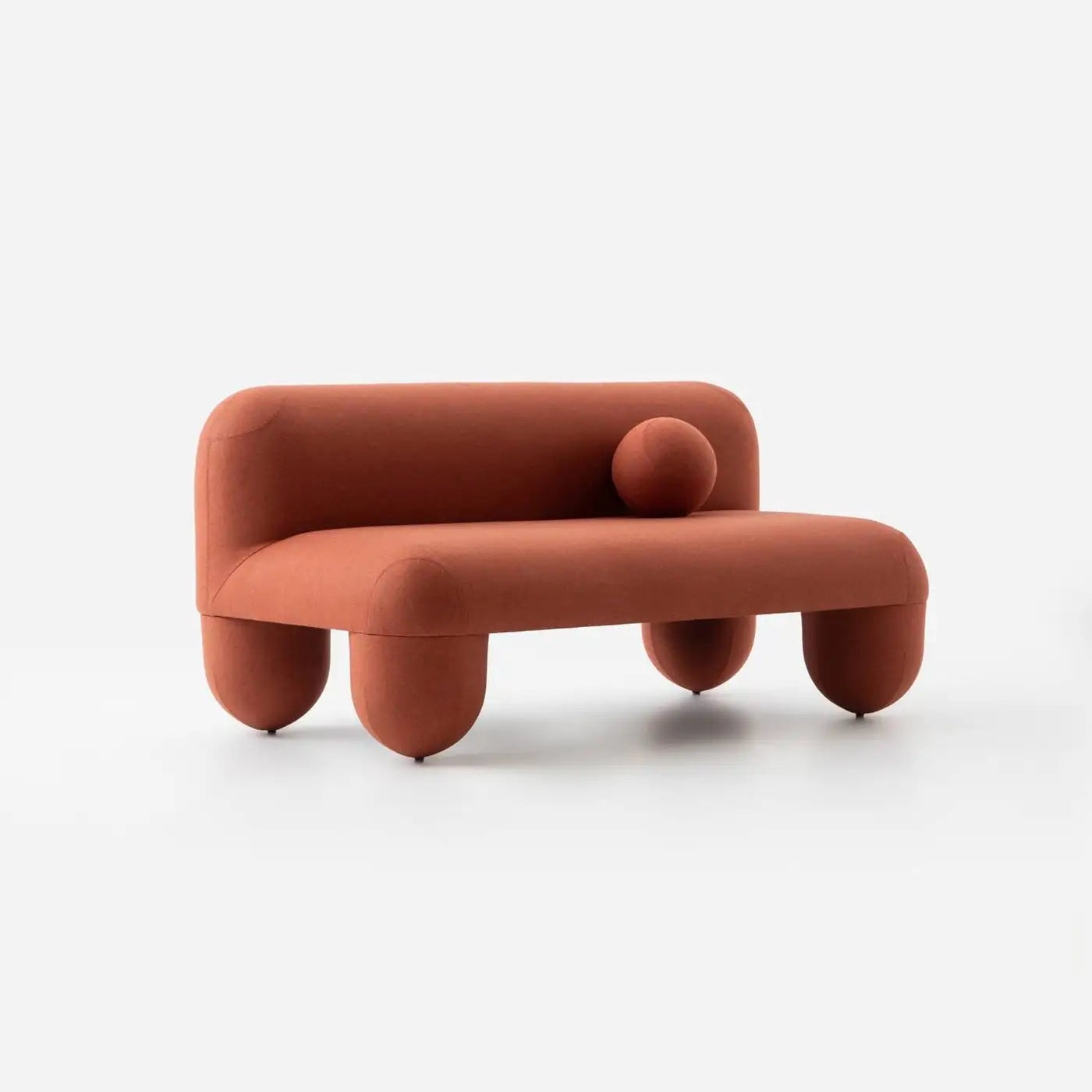 Modern orange-brown sofa with rounded design on a white background