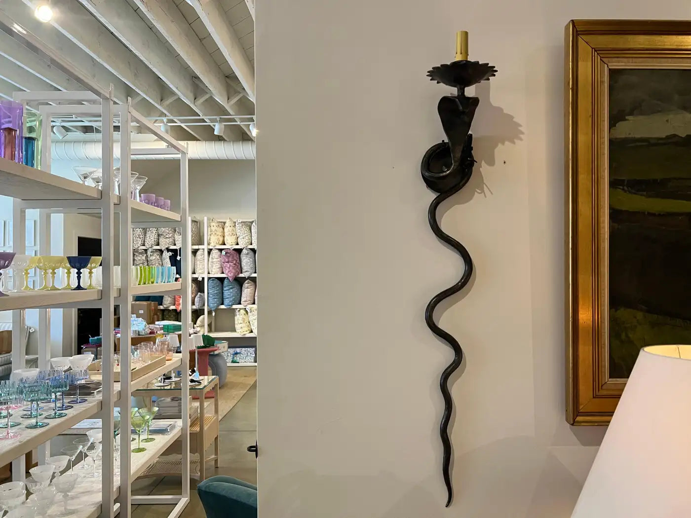 Pair of electrified Serpent Sconces finish in a gunmetal wrought iron finish