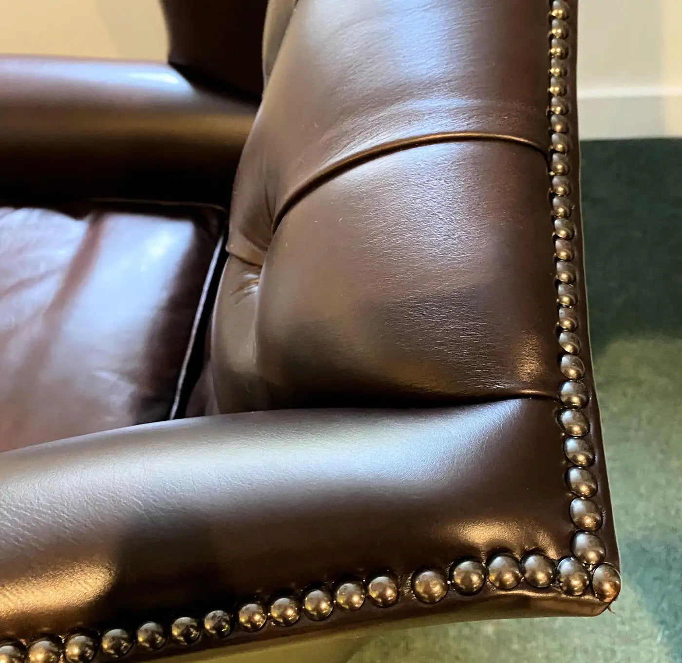 Oversized English Leather Wing Armchair with Mahogany Ball and Claw Legs
