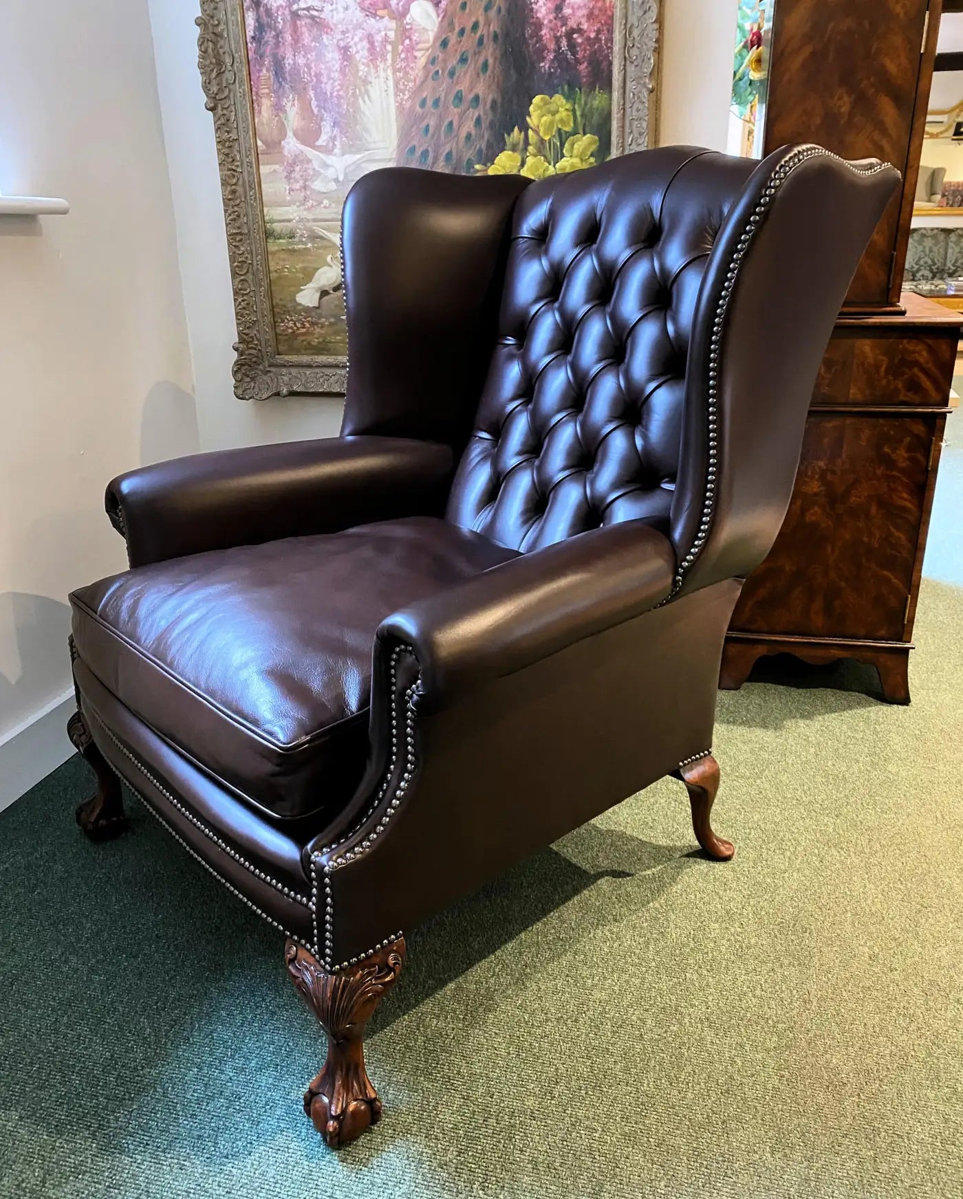 Oversized English Leather Wing Armchair with Mahogany Ball and Claw Legs