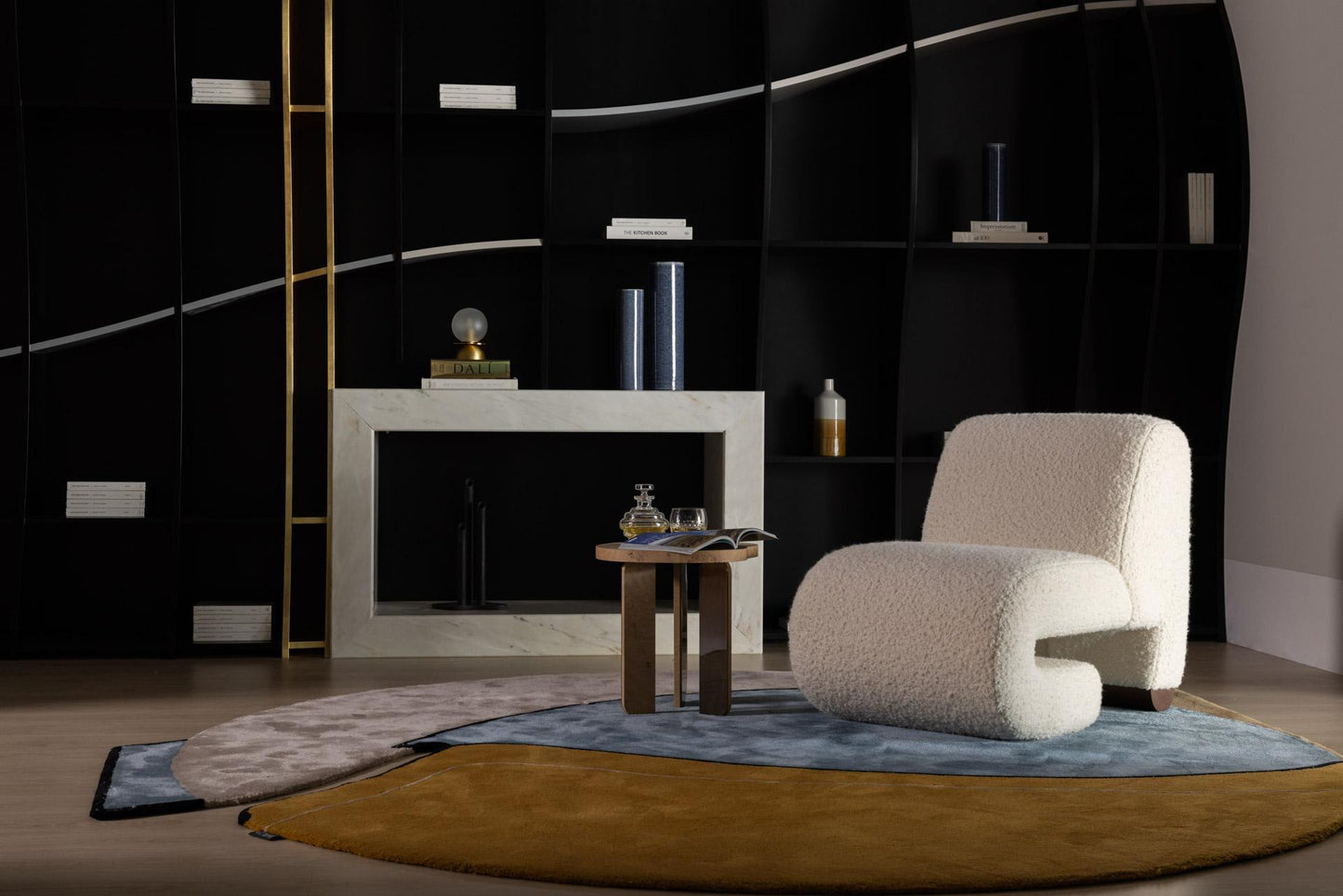 Modern living room with a textured armchair, coffee table, and decorative items.