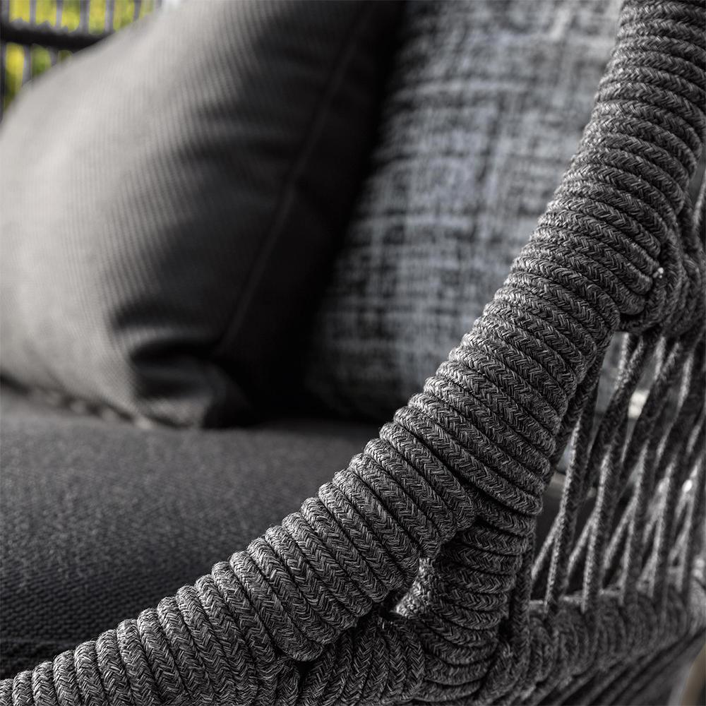 Close-up of a textured gray fabric with a patterned background