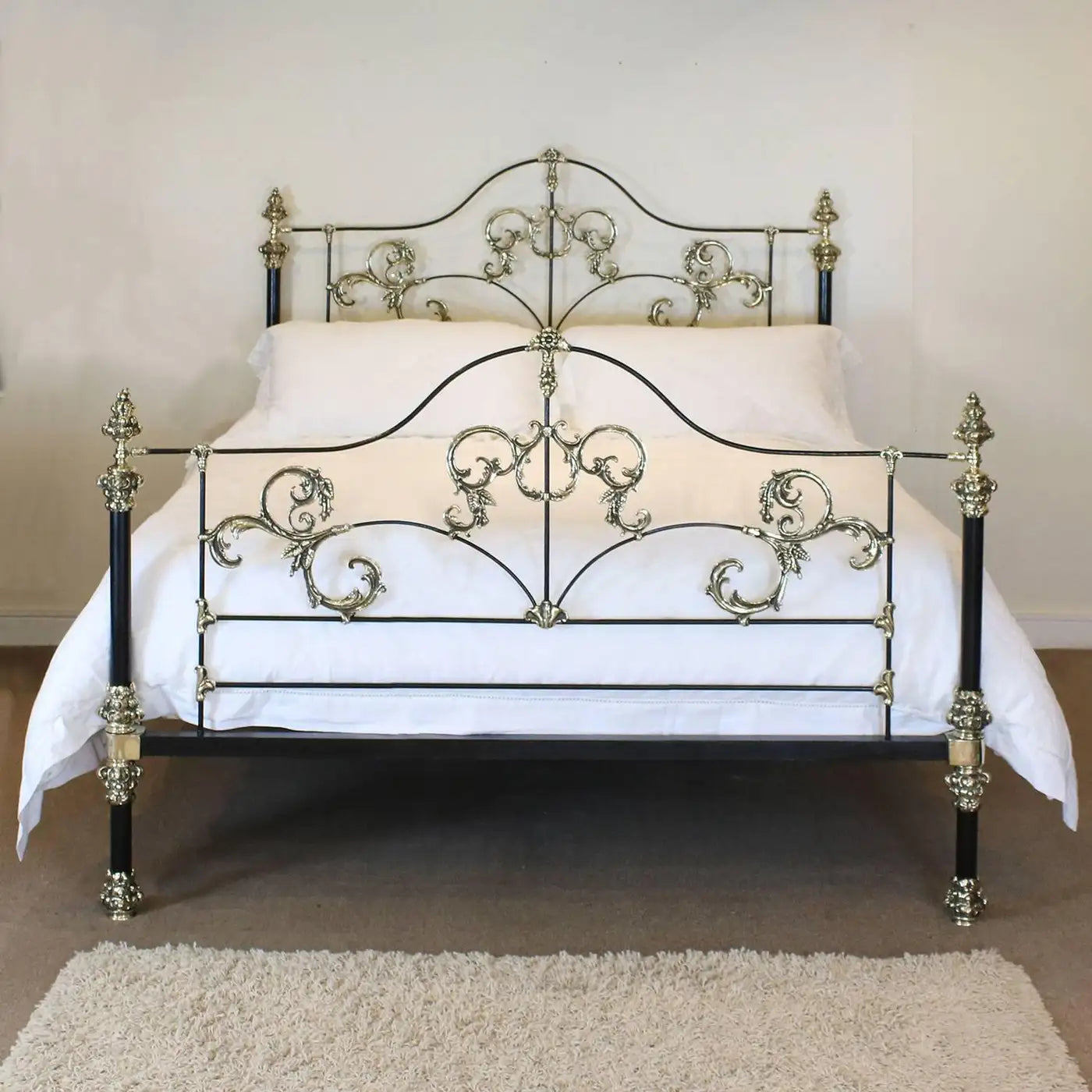Decorative metal bed with intricate designs in a room setting