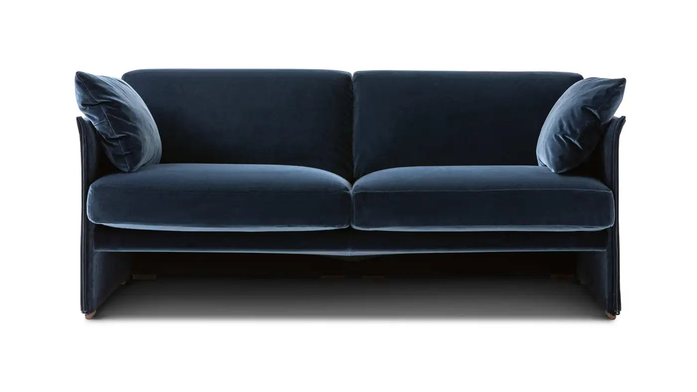 Blue velvet sofa on a white background