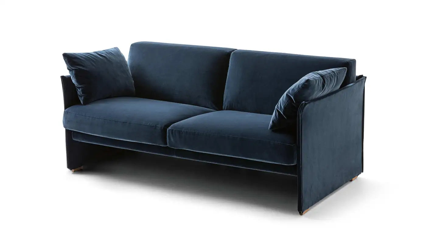 Blue sofa with cushions on a white background