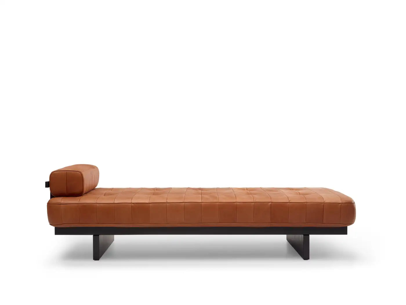 Brown leather daybed on a white background