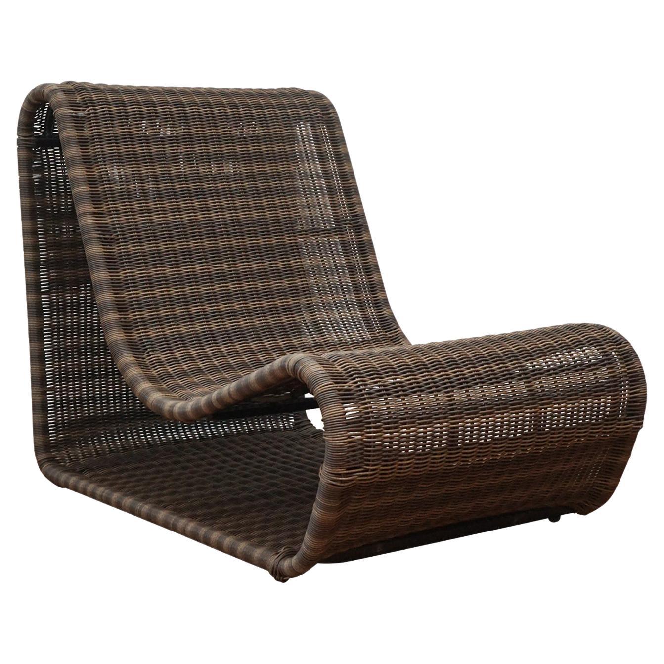Brown wicker chair on a white background