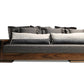 Gray sofa with wooden base on a white background