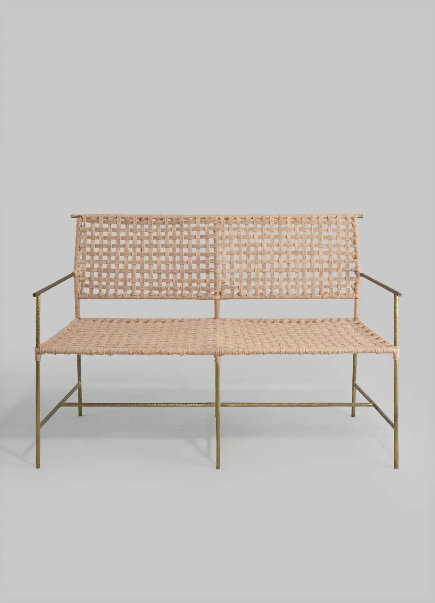 Woven bench with metal frame on a gray background