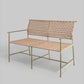 Woven bench with metal frame on a light gray background