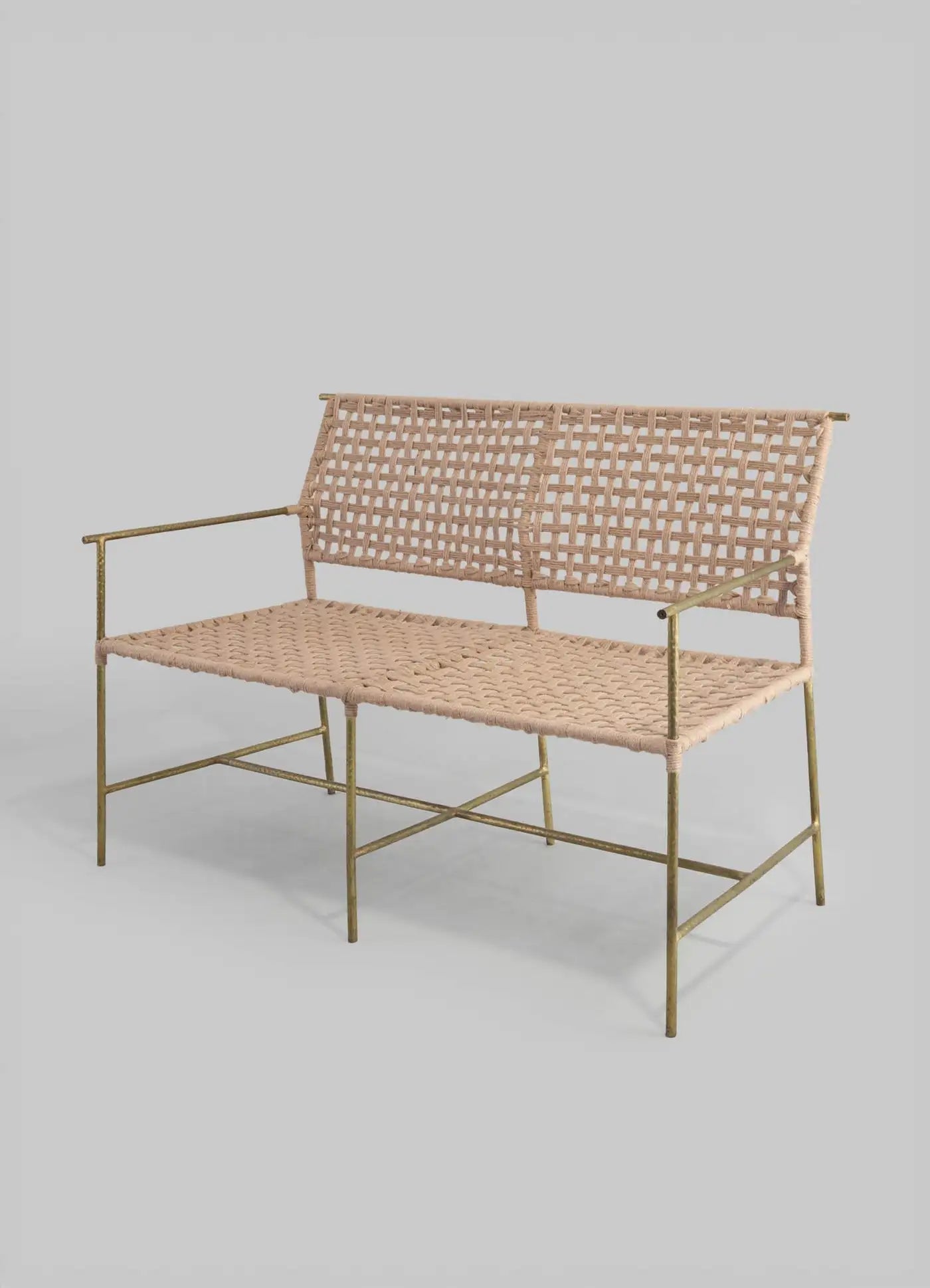 Woven bench with metal frame on a light gray background