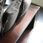 Gray cushions on a wooden bench with a blurred background