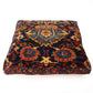 Decorative pillow with intricate pattern on a white background