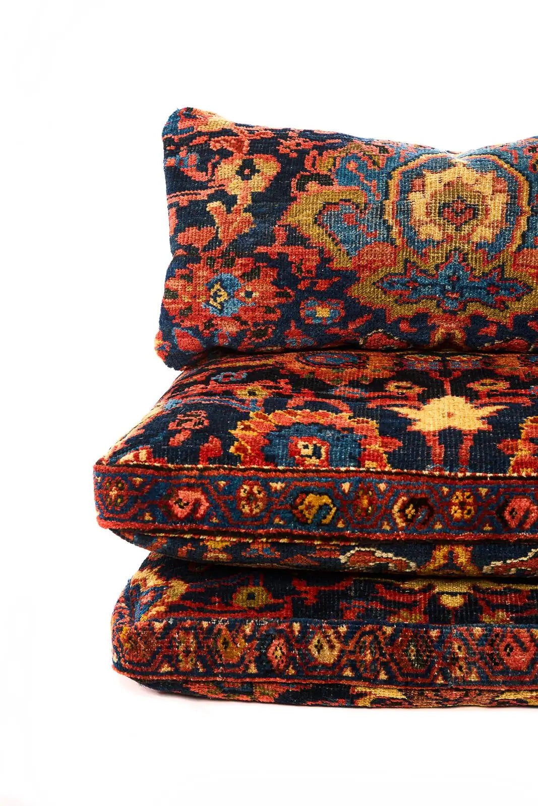 Decorative cushions with intricate patterns on a white background