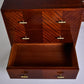 Wooden dresser with open drawer on a white background