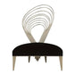 Modern chair with a black seat and silver, wave-like backrest on a white background