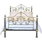 Decorative metal bed with intricate designs on a white background