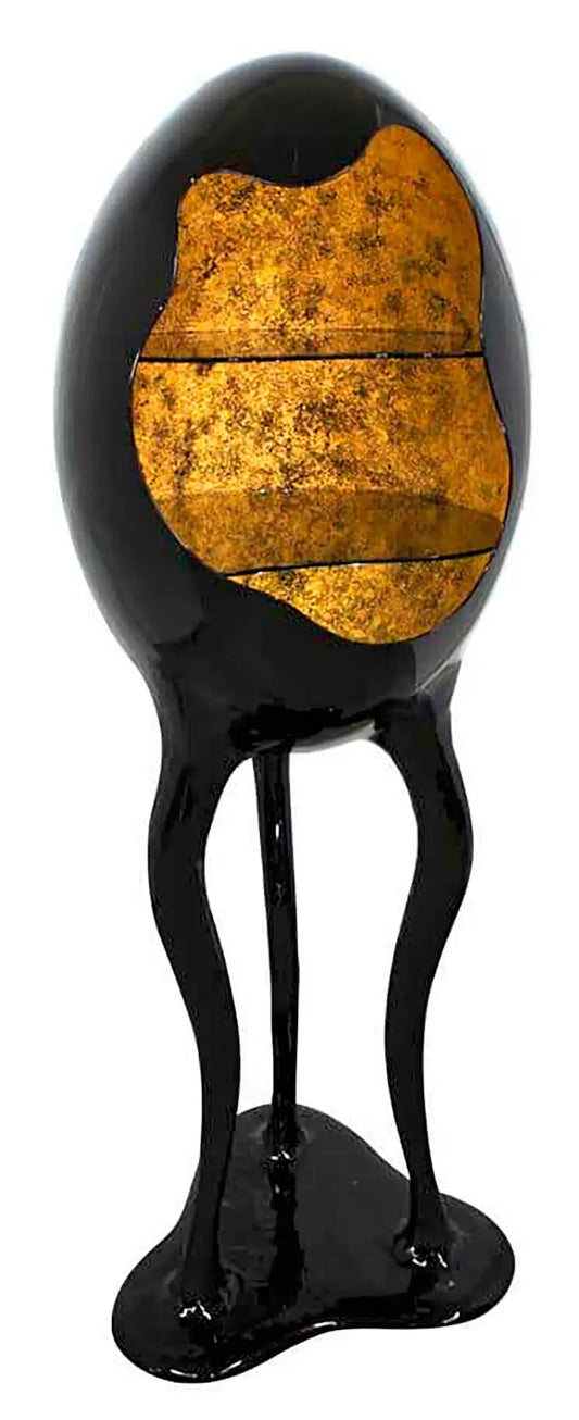 Decorative lamp with black base and gold interior on a white background
