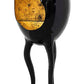 Black and gold artistic sculpture on a white background