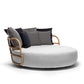 Modern circular sofa with wooden frame and cushions on a white background