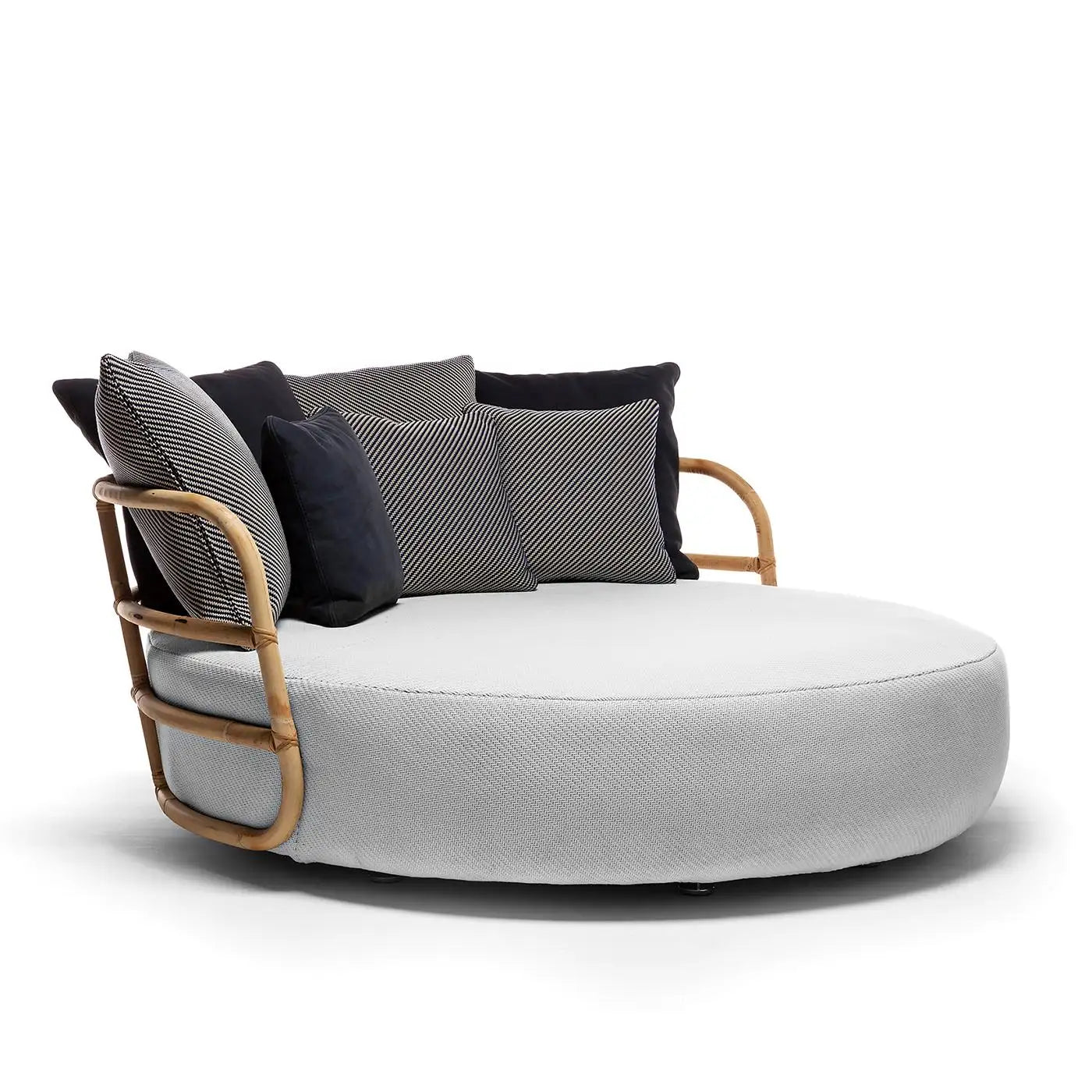 Modern circular sofa with wooden frame and cushions on a white background