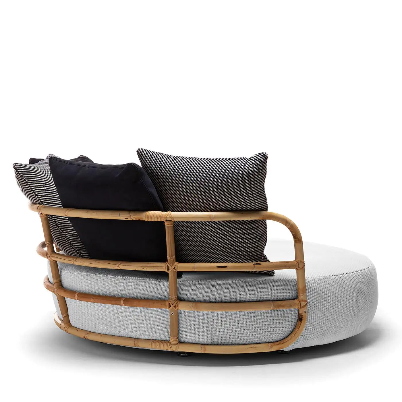 Modern chair with woven backrest and cushions on a white background