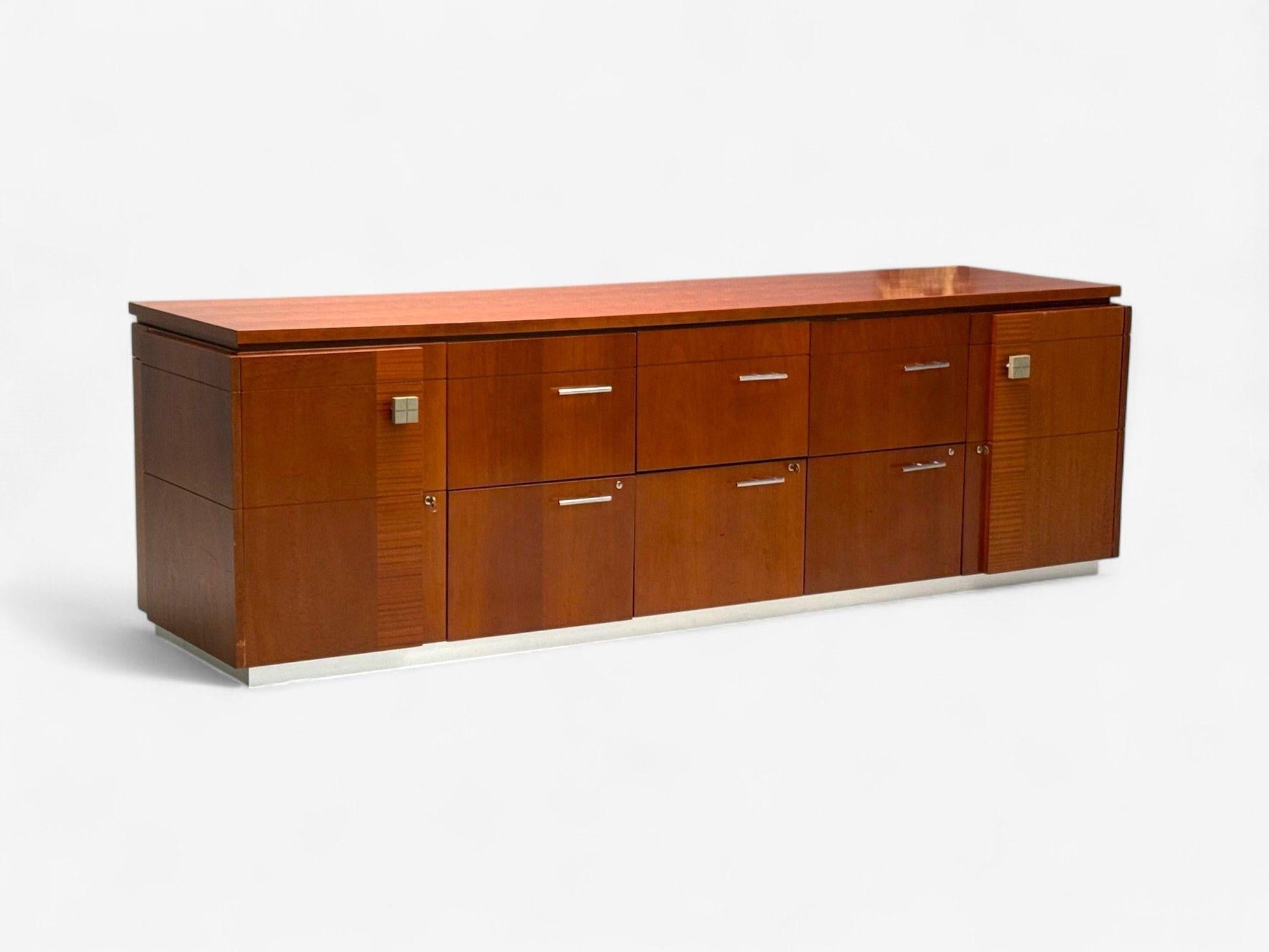Wooden sideboard with multiple drawers on a white background