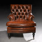 Brown leather armchair on a dark background
