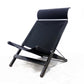 Black folding chair on a white background