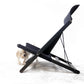 Black pet ramp with a small dog on a white background