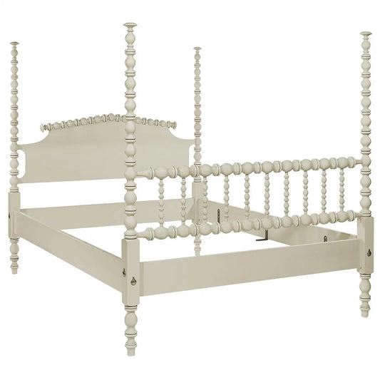 White wooden bed frame with spindle design on a white background