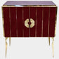 Decorative cabinet with red panel design and gold accents on a white background